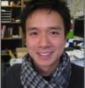 Sui Phang, an Asian man with short black hair and light skin, wearing a scarf