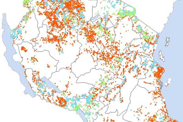 A map of Tanzania with orange, blue, yellow, and green dots scattered across it