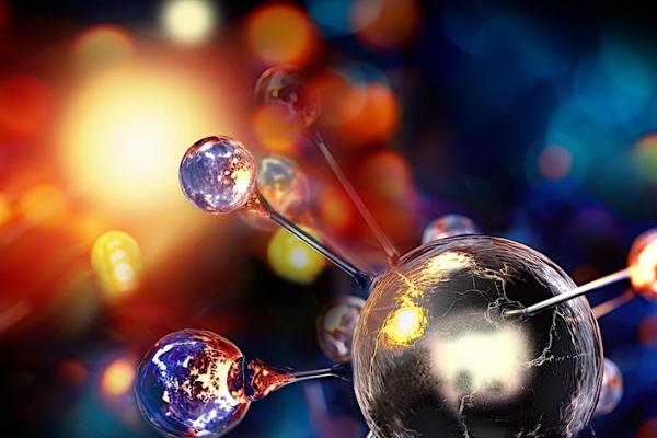 a colorful image with a glass globe and spikes with smaller glass globes, representing an atom of some element.