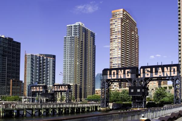 City Skyscraper Skyline of Long Island, under blue skies.